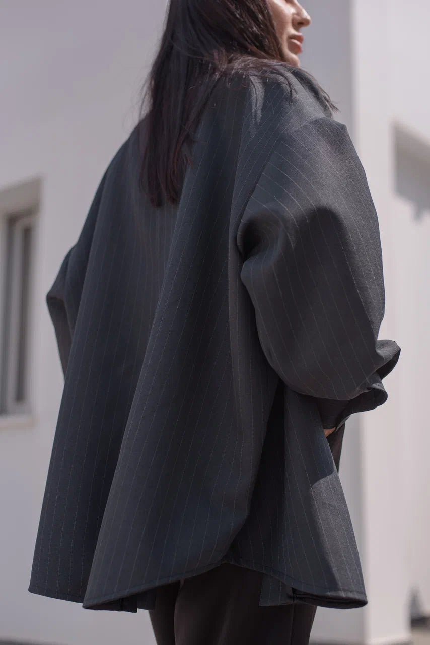 Close-up of the pinstripe fabric on the blazer shirt.